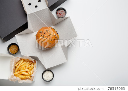 Delicious junk fast food, snacks delivery to client home or office during COVID-19 epidemic Delicious junk fast food, snacks delivery to client home or office during COVID-19 epidemic 76517063