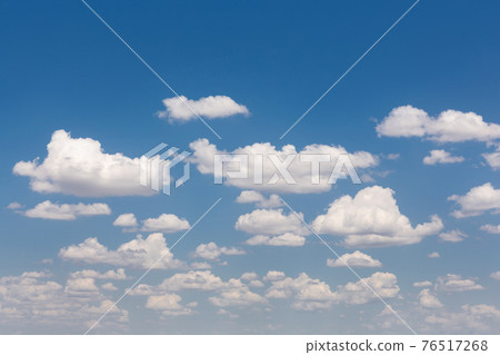 many white cumulus clouds on a blue sky, landscape many white cumulus clouds on a blue sky, landscape 76517268