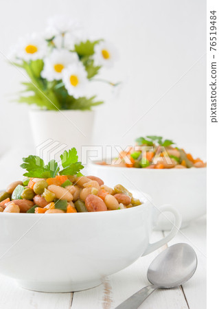 Healthy grain salad in bowl on wooden table Healthy grain salad in bowl on wooden table 76519484