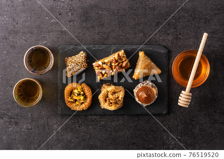 Assortment of Ramadan dessert baklava on black background 76519520