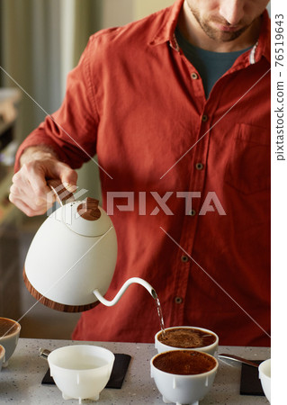 Young Woman Pouring Coffee Young Woman Pouring Coffee 76519643