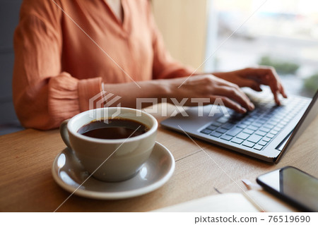 Young Businesswoman Enjoying Work in Cafe Young Businesswoman Enjoying Work in Cafe 76519690