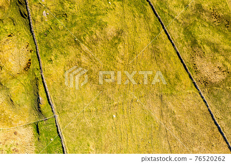 Aerial view of Dunmore Head by Portnoo in County Donegal, Ireland. Aerial view of Dunmore Head by Portnoo in County Donegal, Ireland. 76520262