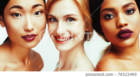 different nation woman: african-american, caucasian, asian together isolated on white background happy smiling, diverse type on skin, lifestyle people concept different nation woman: african-american, caucasian, asian together isolated on white background happy smiling, diverse type on skin, lifestyle people concept 76522460