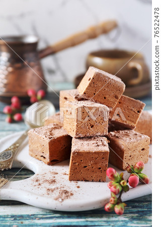 Homemade chocolate marshmallows cubes sweets and coffee cup Homemade chocolate marshmallows cubes sweets and coffee cup 76522478