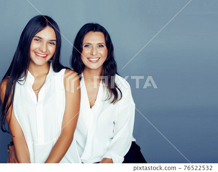 cute pretty teen daughter with mature mother hugging, fashion style brunette, lifestyle people concept cute pretty teen daughter with mature mother hugging, fashion style brunette, lifestyle people concept 76522532