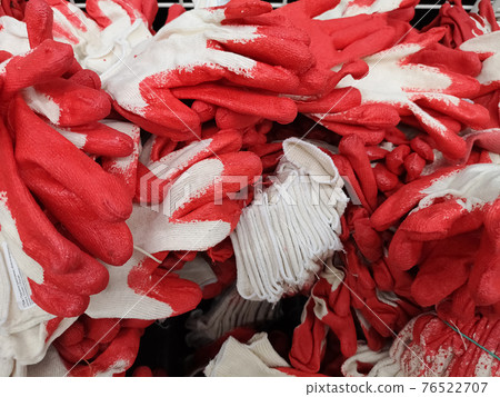 Box with rubberized gloves for gardening in a large building store Box with rubberized gloves for gardening in a large building store 76522707
