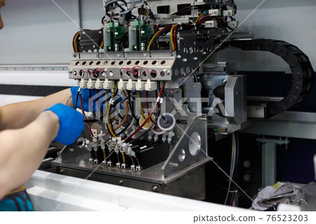 maintenance work on large format fabric printer 76523203