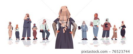 rear view businesswoman standing in front of arabic businesspeople team leader leadership concept 76523744