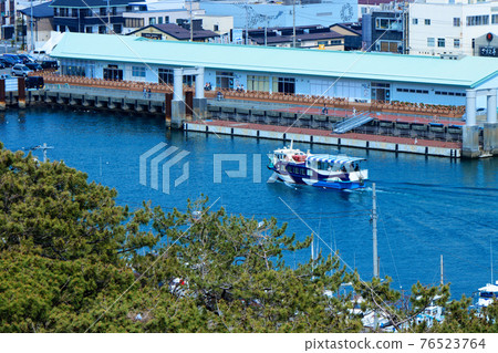 Pleasure boat overlooking Numazu Port from the large observatory water gate "Byuo" at Numazu Port 76523764