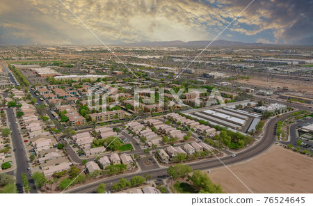 Aerial view of mixing single family homes, apartment buildings a residential district a Avondale near Phoenix Arizona US Aerial view of mixing single family homes, apartment buildings a residential district a Avondale near Phoenix Arizona US 76524645