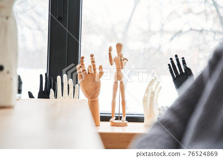 Different hands standing at the windowsill at the office of the engineers 76524869