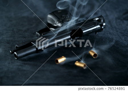 Post-fire pistol M92F military model and cartridge case 76524891