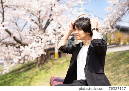 Men enjoying music content 76527117