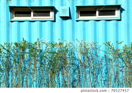 Light blue prefabricated hut wall 76527457