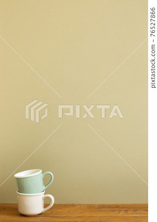 Stack of mug cup on wooden table. khaki beige background 76527866