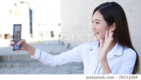 Asiian businesswoman has video chat Asiian businesswoman has video chat 76531094