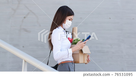 Asian woman being fired 76531095