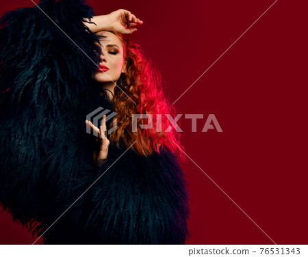 Gorgeous rich young woman with red curly hair Gorgeous rich young woman with red curly hair 76531343