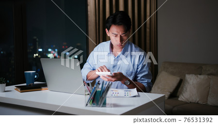 businessman overtime work at home businessman overtime work at home 76531392