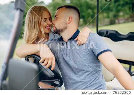 Beautiful couple spend time on a summer forest 76532800
