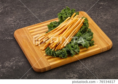 Chechel cheese sticks over board Chechel cheese sticks over board 76534817