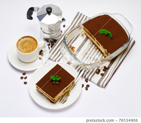 Traditional Italian Tiramisu dessert in glass baking dish, portion on plate and cup of coffee isolated on white background Traditional Italian Tiramisu dessert in glass baking dish, portion on plate and cup of coffee isolated on white background 76534908