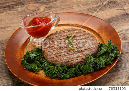 Grilled beef cutlet for burger Grilled beef cutlet for burger 76535103