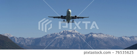 The plane is landing at the airport The plane is landing at the airport 76535625