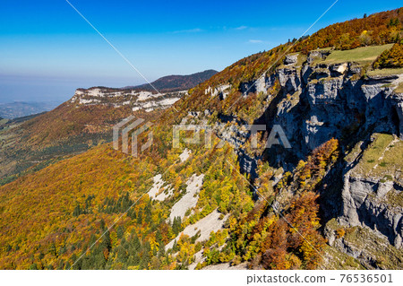 French countryside. Pas de l'Aubasse: View of the heights of the Vercors, the marly hills and the valley Val de Drome 76536501