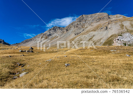 Landscape view of Col de la Cayolle pass and surrounding mountains in France Landscape view of Col de la Cayolle pass and surrounding mountains in France 76536542