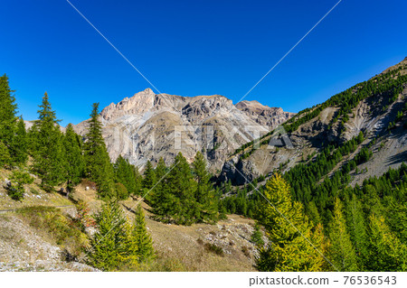Landscape view of Col de la Cayolle pass and surrounding mountains in France 76536543