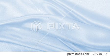 Smooth elegant blue silk or satin luxury cloth texture as abstract background. Luxurious background design Smooth elegant blue silk or satin luxury cloth texture as abstract background. Luxurious background design 76538194