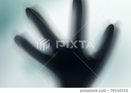 Silhouette of spooky alien and bright light on behind him Silhouette of spooky alien and bright light on behind him 76538358