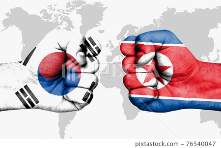 Conflict between South Korea and North Korea - male fists Conflict between South Korea and North Korea - male fists 76540047