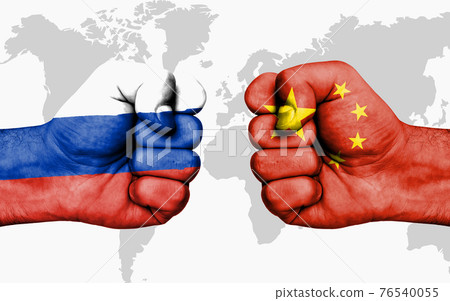 Conflict between Russia and China - male fists 76540055