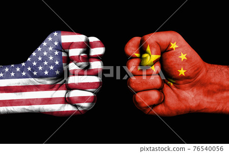 Conflict between USA and China - male fists 76540056