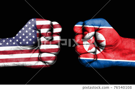 Conflict between USA and North Korea - male fists Conflict between USA and North Korea - male fists 76540108