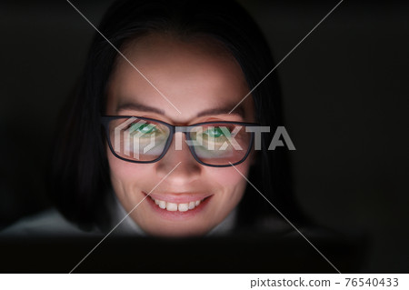 Portrait of woman with tablet at night. Portrait of woman with tablet at night. 76540433