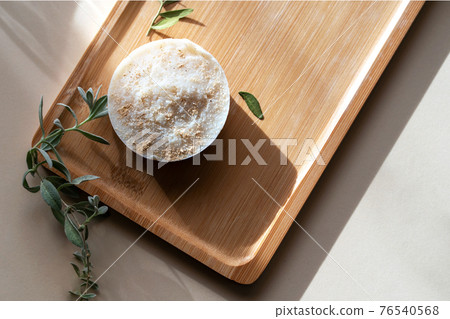 Wooden tray with handmade soap from natural ingredients. Wooden tray with handmade soap from natural ingredients. 76540568