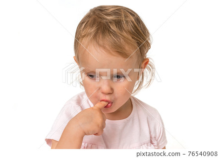 Little baby with finger inside mouth Little baby with finger inside mouth 76540908