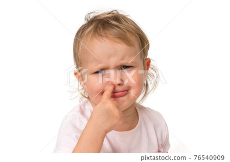 Sad baby girl is picking her nose with finger inside Sad baby girl is picking her nose with finger inside 76540909