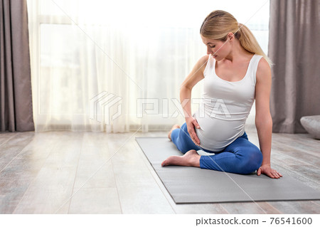 flexible lady in sportswear engaged in workout at home, stretch the body, train body muscles flexible lady in sportswear engaged in workout at home, stretch the body, train body muscles 76541600