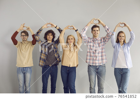 Group of teenage student showing love sympathy make heart gesture studio shot Group of teenage student showing love sympathy make heart gesture studio shot 76541852