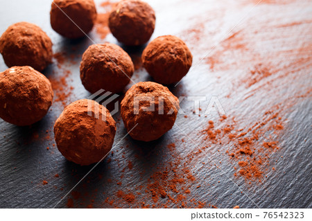 Chocolate vegetarian truffels candies with dates 76542323