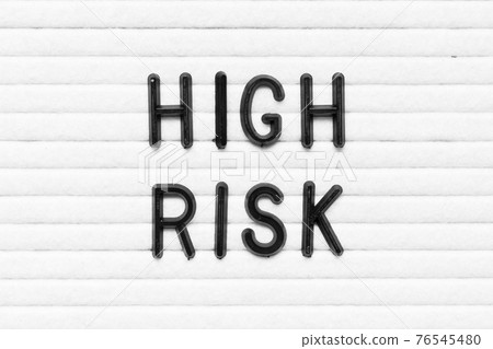 Black alphabet letter in word high risk on white felt board background Black alphabet letter in word high risk on white felt board background 76545480