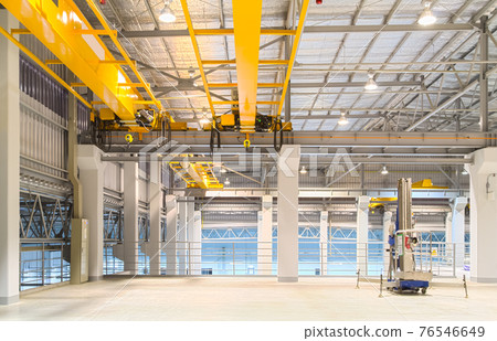 Overhead crane inside factory or warehouse for manufacturing production plant. 76546649