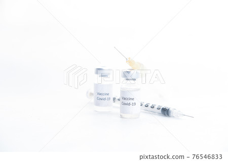 coronavirus vaccine and syringe on white background coronavirus vaccine and syringe on white background 76546833