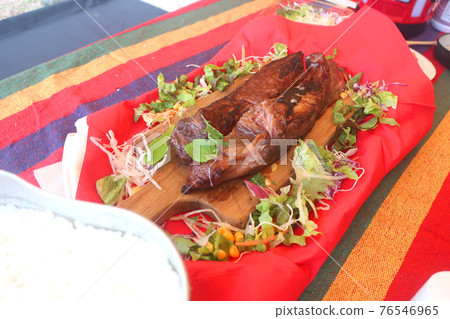 Grilled ribs on the barbecue 76546965