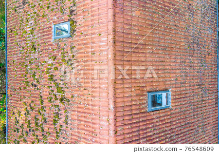 Inspection of the red tiled roof of a single-family house 76548609